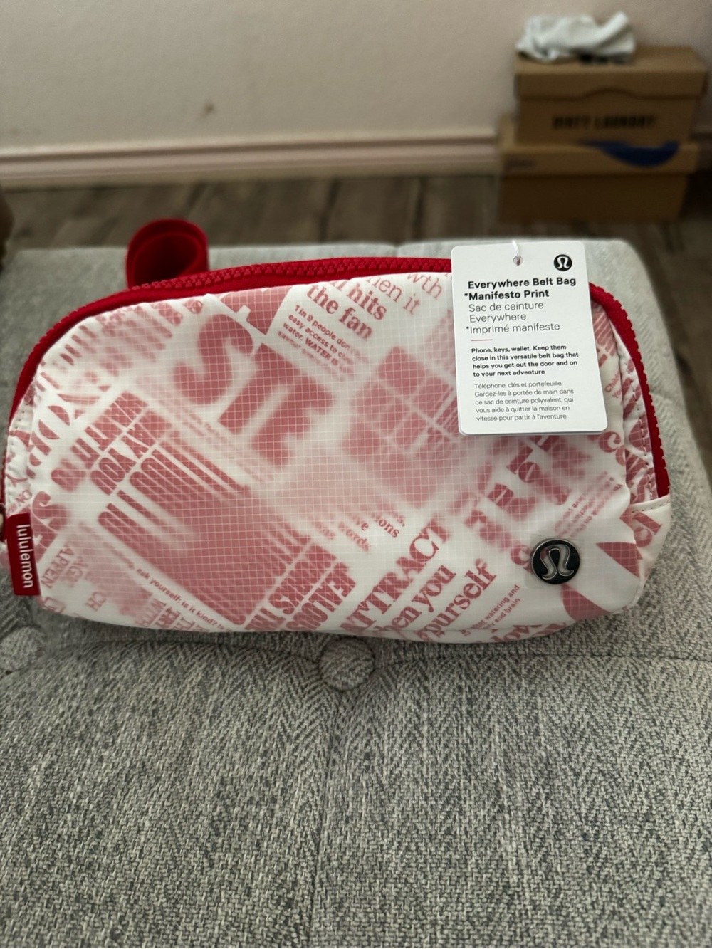 NWT, Lululemon everywhere belt bag in the “ manifesto” print. Red belt strap
